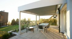black metal table and chairs on green grass field during daytime