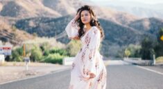 woman standing in the middle of the road